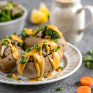30-Minute Broccoli Cheddar Stuffed Potatoes! Easy time-friendly AND budget friendly vegan meal that is delicious and nutritious! #budget #30minutemeal #cheap #lazy #healthy #oilfree #stuffedpotatoes #vegancheddar #vegancheese #cheesesauce #dinner #lunch #entree