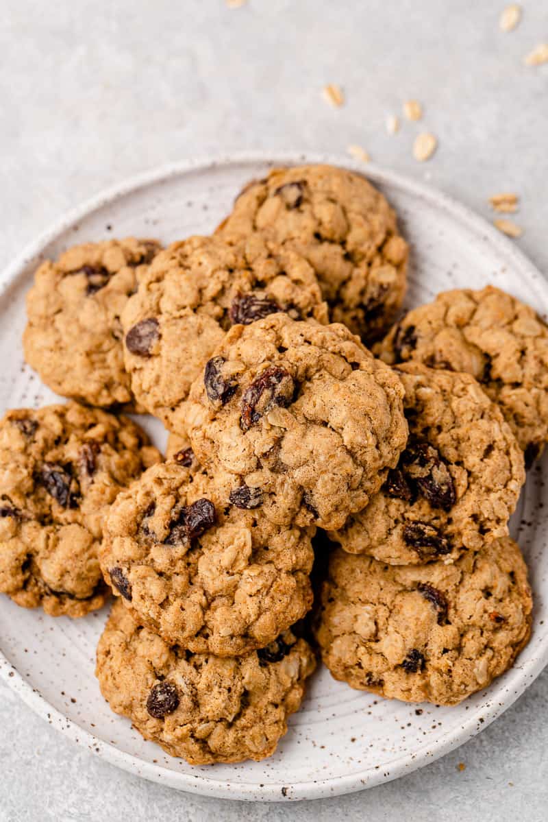 vegan oatmeal raisin cookies on a white plate by sweet simple vegan