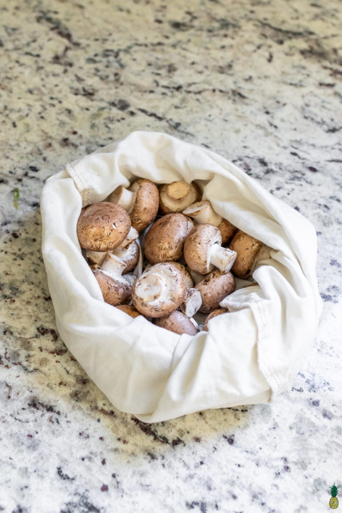 brown mushrooms in a cloth bag for the refrigerator