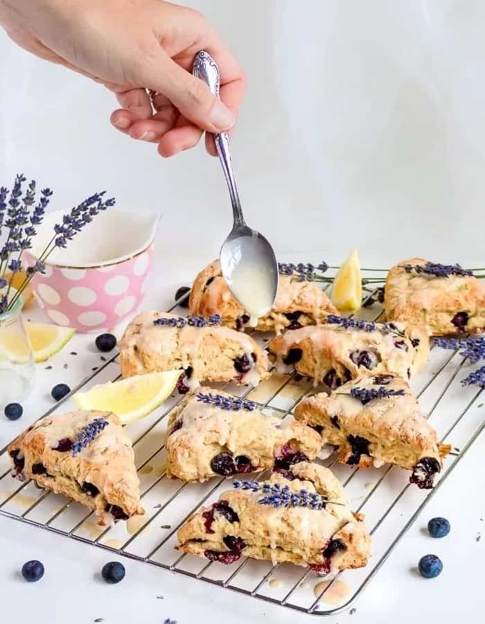 blueberry scones drizzled with frosting.