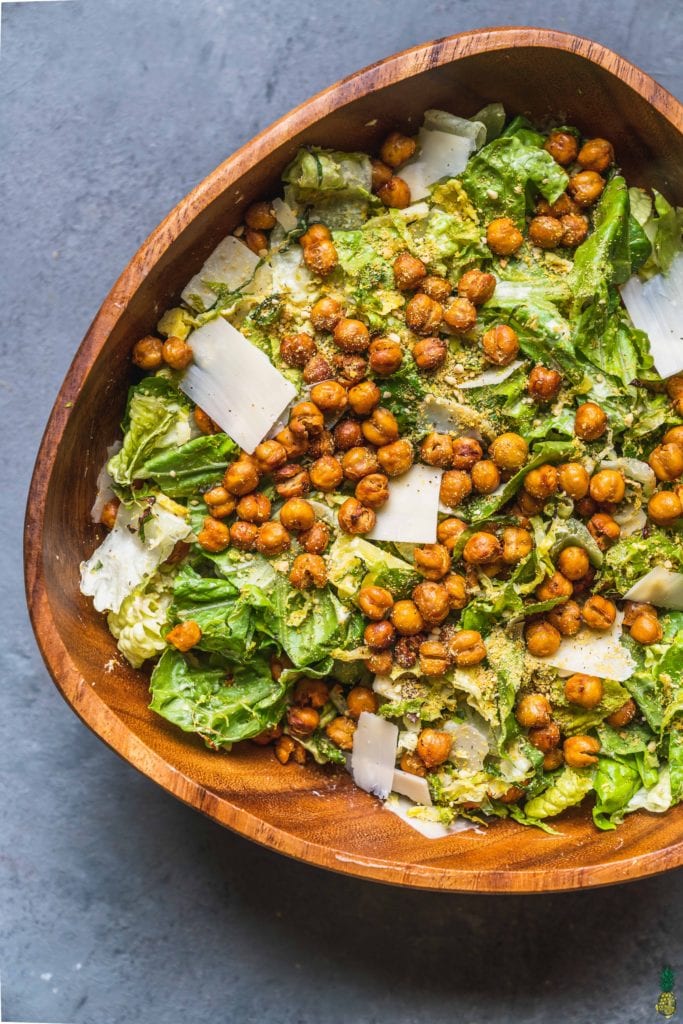 Christmas Recipe - over head of brussels sprouts caesar salad in large wooden bowl