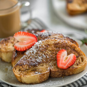 french toast on plate with strawberries
