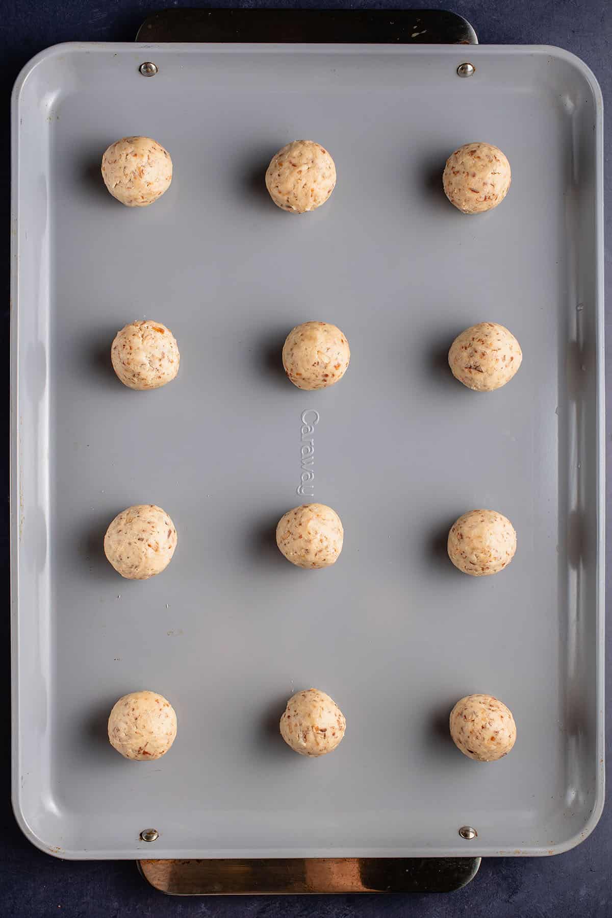 unbaked coconut sugar cookies on baking sheet