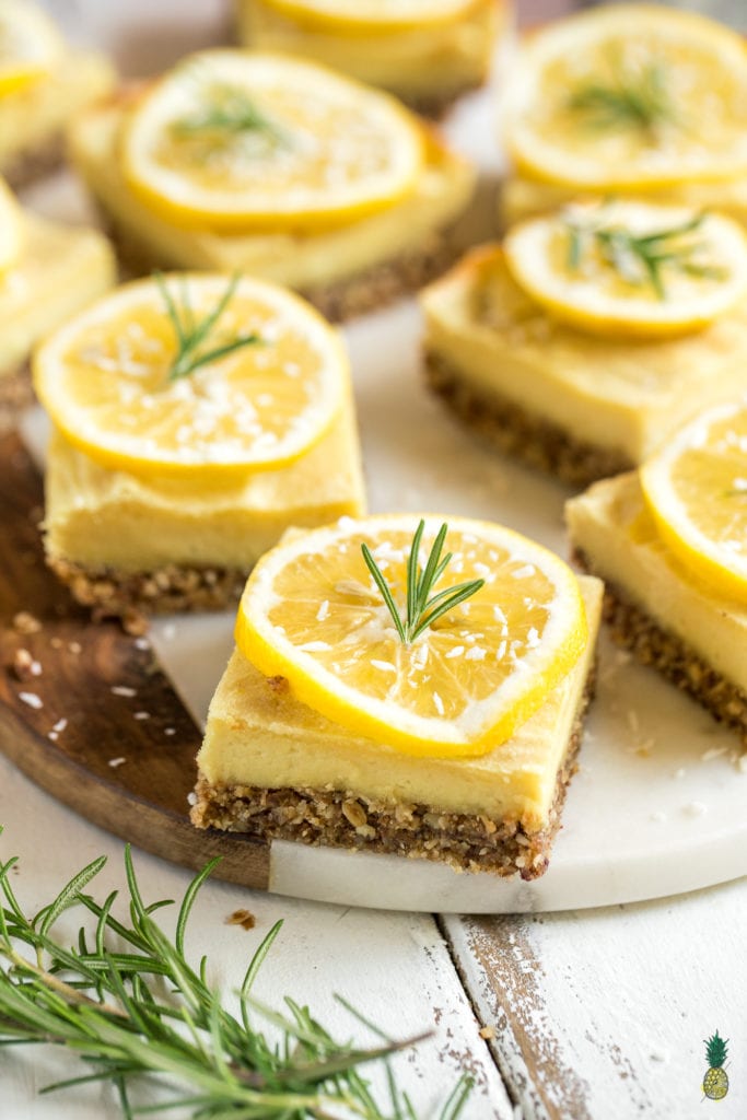 macro image of spring desserts topped with a lemon slice and rosemary.