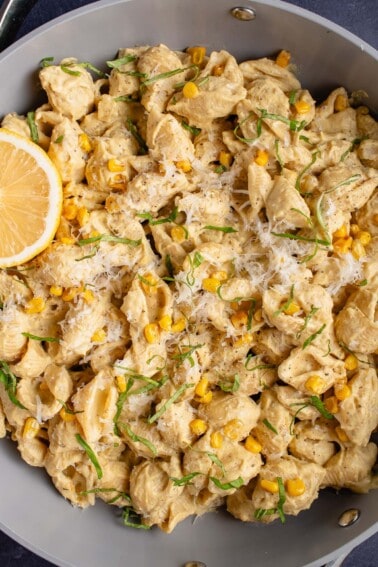 upclose image of creamy corn pasta in a pan