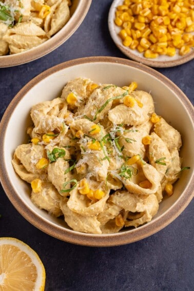 bowl of creamy corn pasta with sides