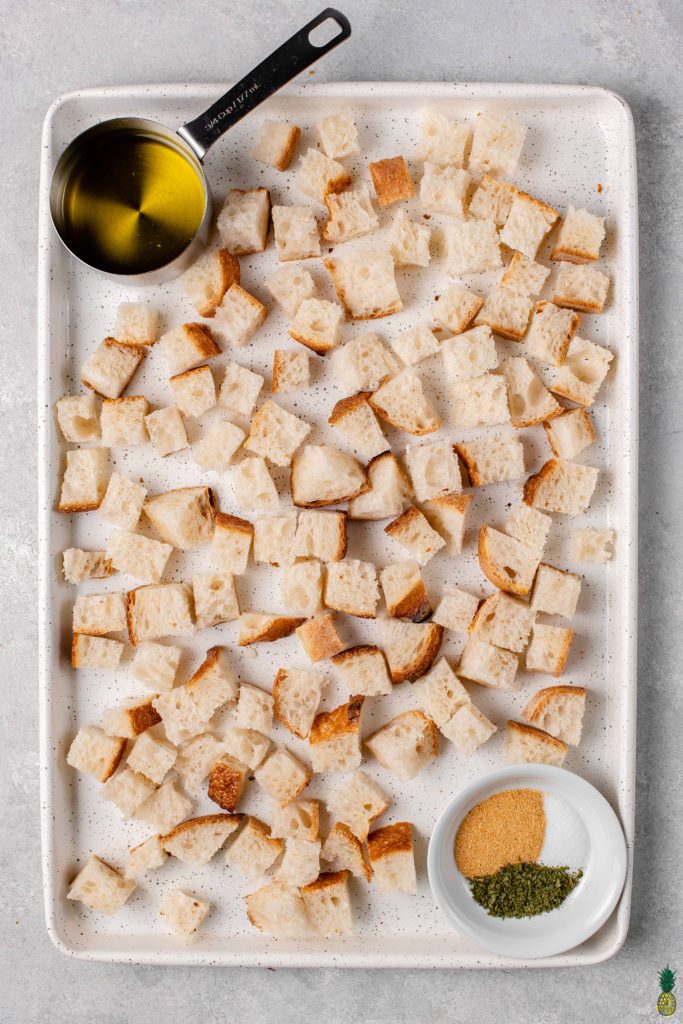 overhead image of easy 5-ingredient croutons on a sheet pan