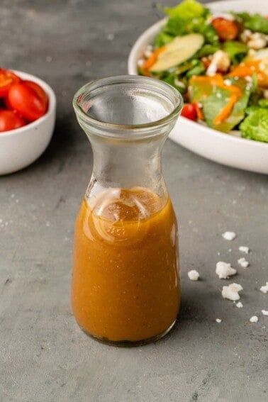 image of balsamic vinaigrette in a jar with styled background