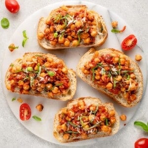 chickpea and tomato toast in marble board