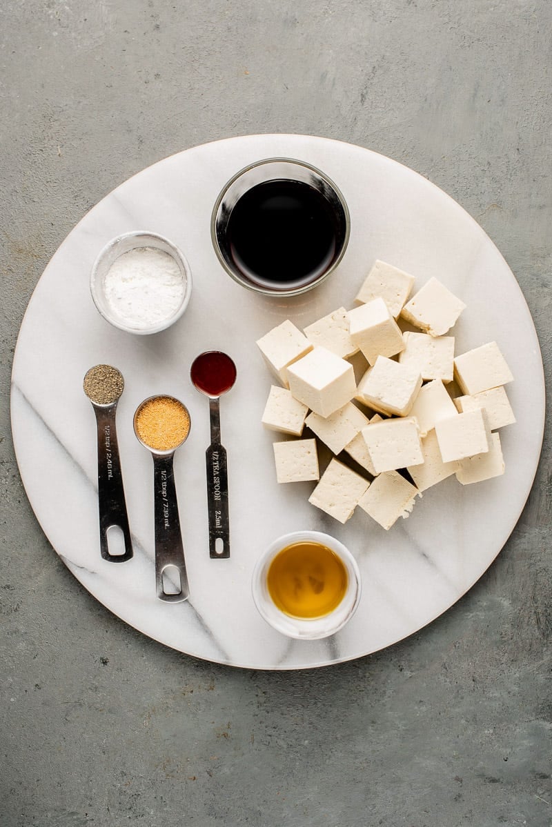 overhead image of ingredients for crispy baked tofu on white plate