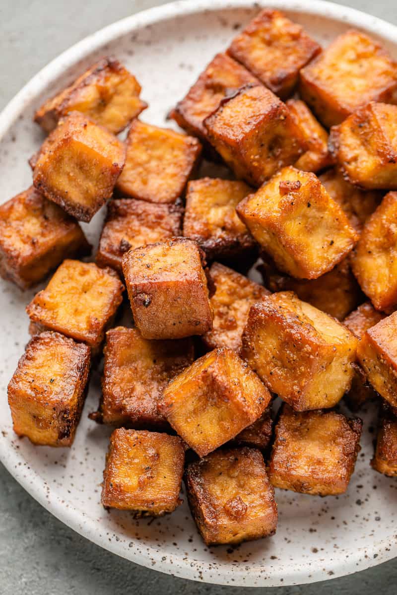 macro image of crispy baked tofu on a plate