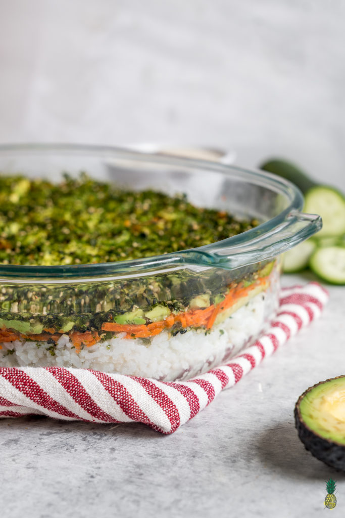 This easy vegan sushi casserole deserves a place at your dinner table or your next gathering! It is the perfect mix of salty, creamy and crunchy + it requires just 6 simple ingredients to make. #sushi #casserole #easy #6ingredients #vegan #vegansushi #easyvegan #veganparty #partyrecipe #foolproof #musttryvegan #musttry #avocado #easysushi #entree #party #lunch #dinner