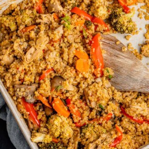 fall-inspired quinoa casserole in large baking dish with spoon