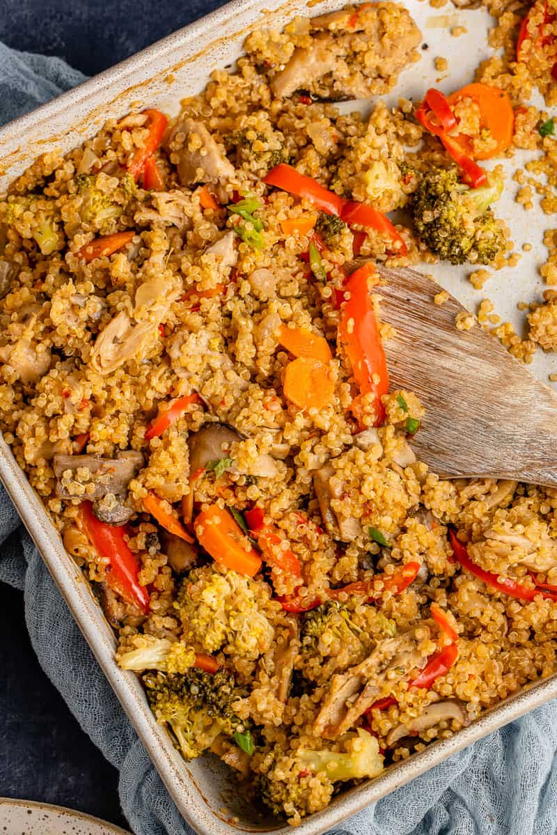 fall-inspired quinoa casserole in large baking dish with spoon