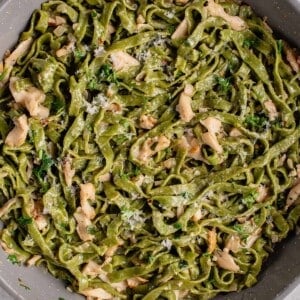 fresh spinach pasta in pan with mushroom butter sauce