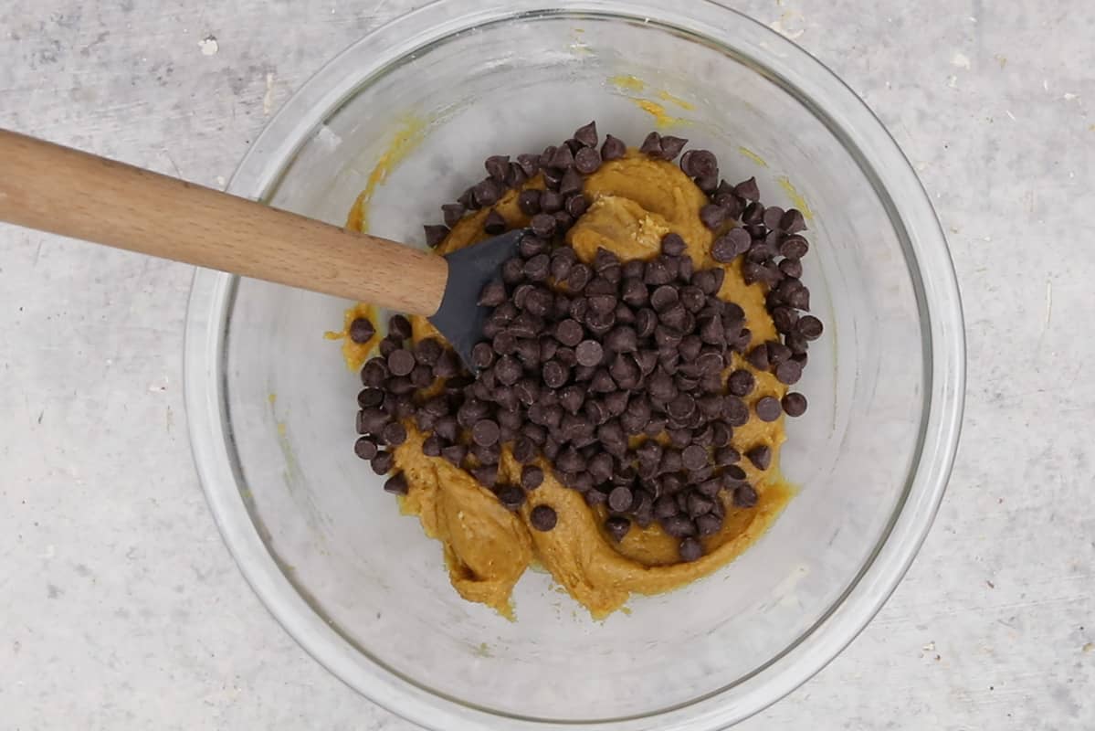 pumpkin chocolate chip cookie dough in glass bowl