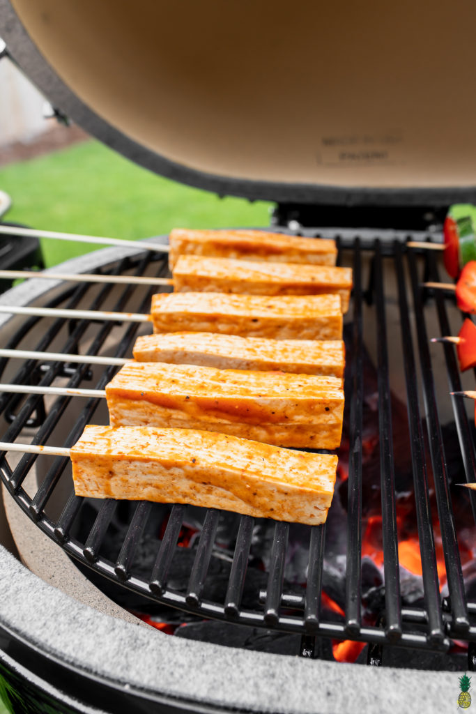 barbecue tofu skewers on grill side angle 