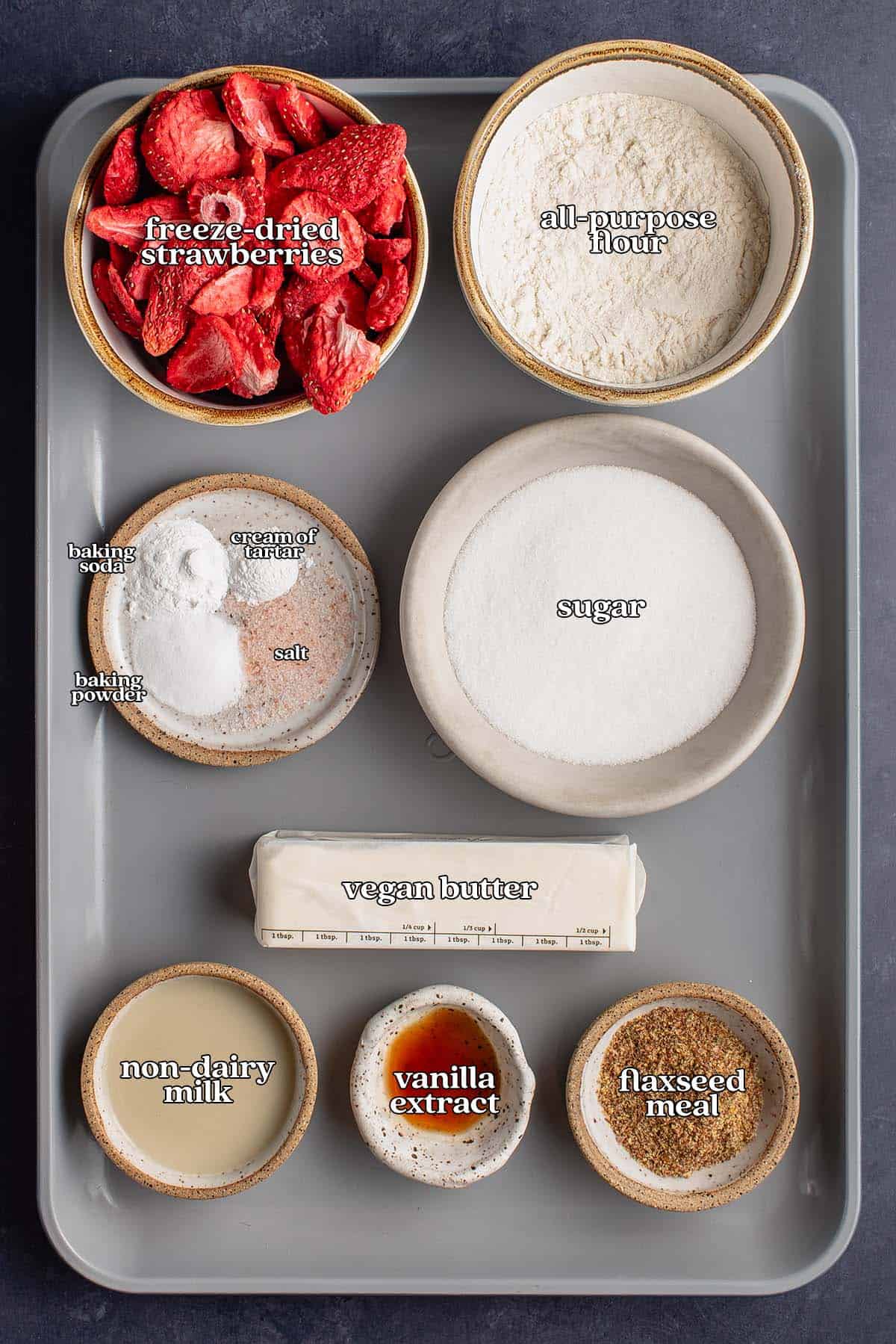 labeled ingredients for vegan strawberry sugar cookies on nonstick pan
