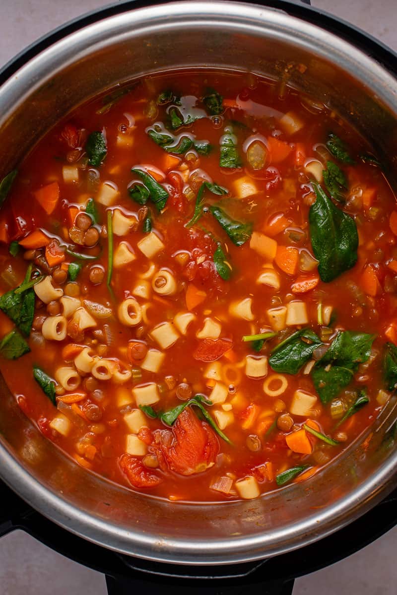 instant pot filled with lentil noodle soup