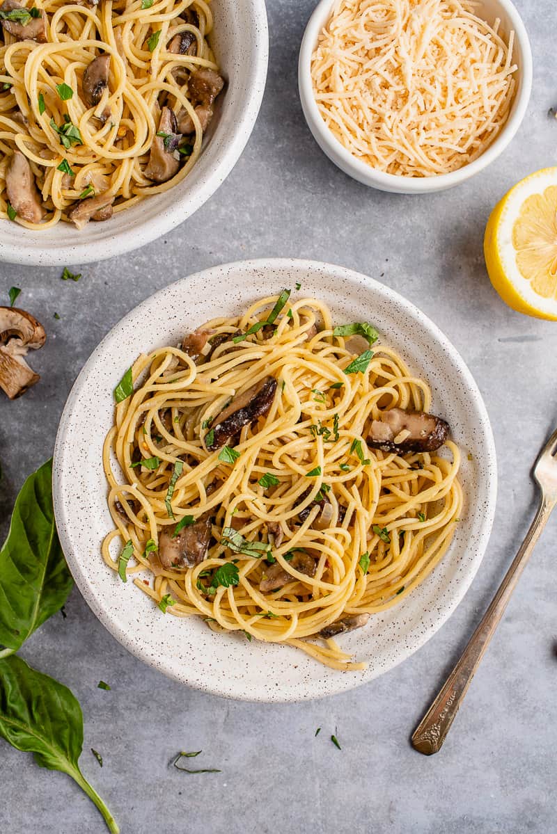 vertical photo of Miso Garlic Butter Pasta in a white bowl