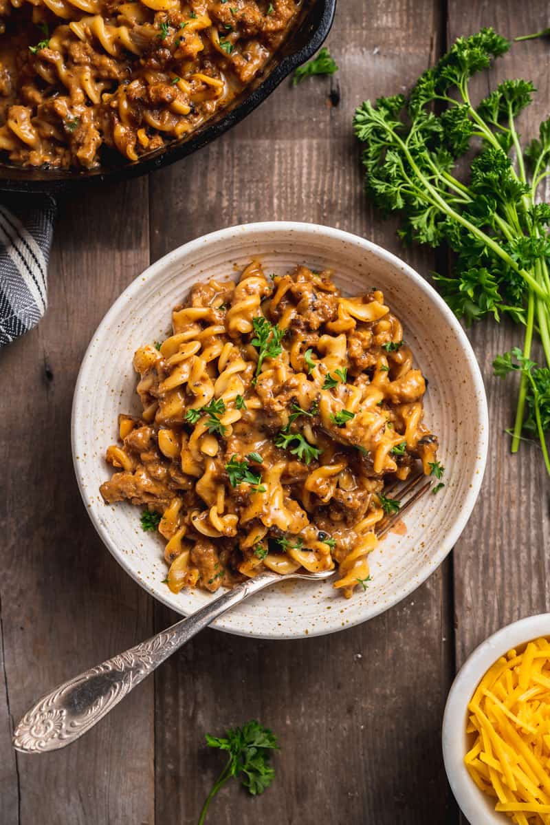 overhead image of one pot vegan hamburger helper in a bowl with fork