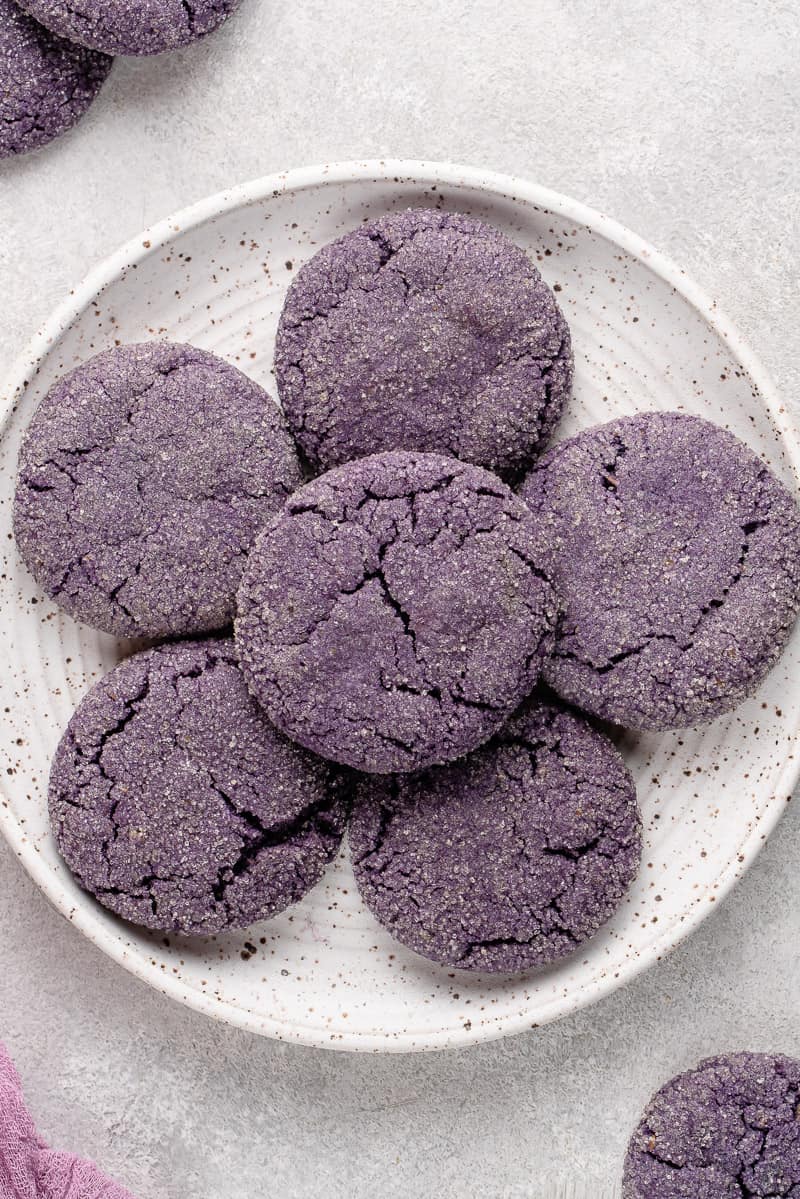 white plate filled with vegan ube sugar cookies