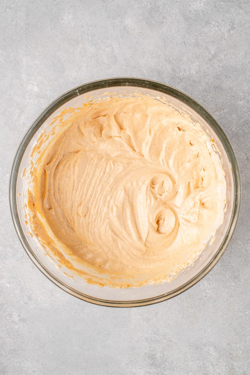 vegan pumpkin whipped cream in a clear bowl