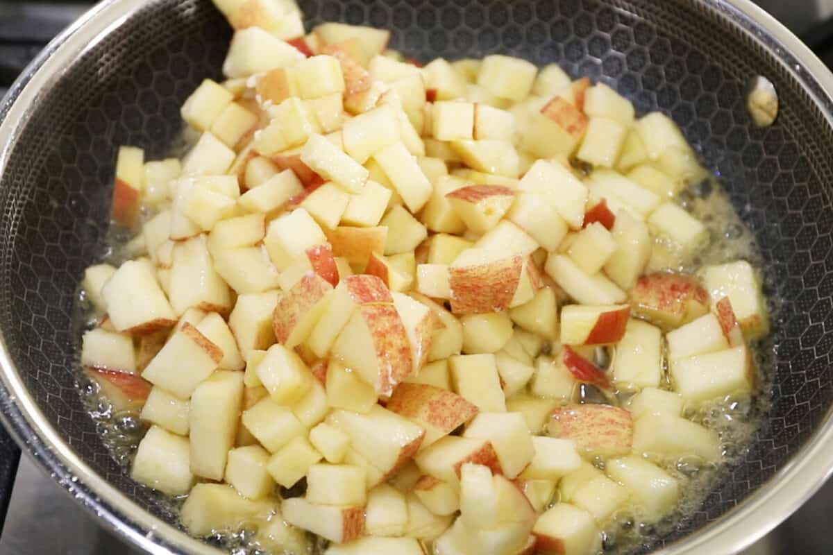 apples being cooked in butter