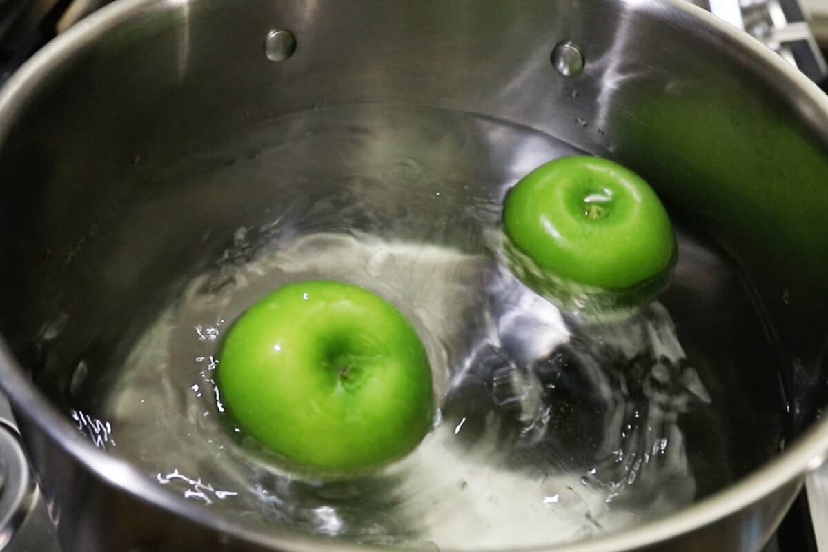 green apples in boiling water