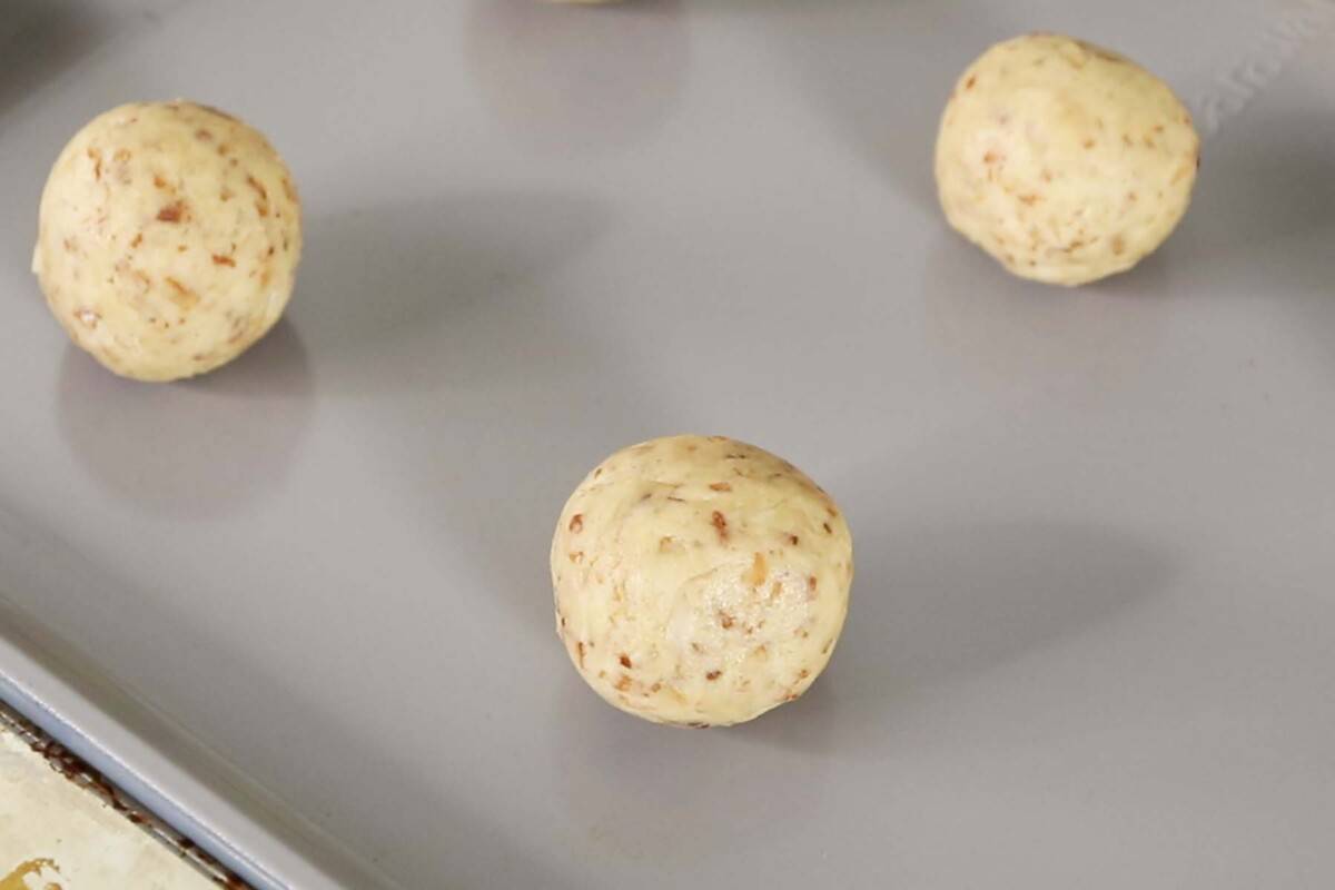 unbaked coconut sugar cookies on baking sheet