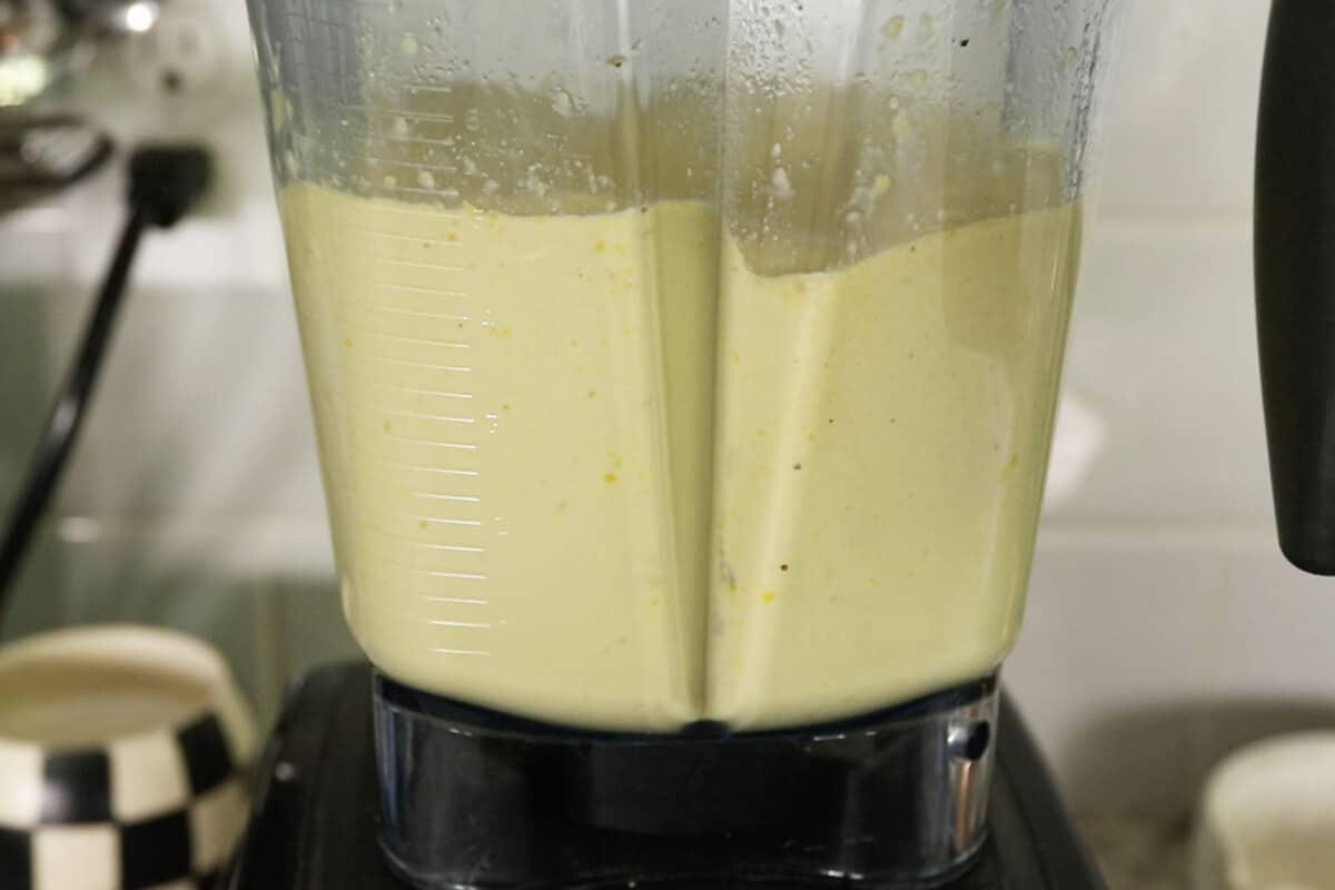 step by step of sauce being blended in a blender