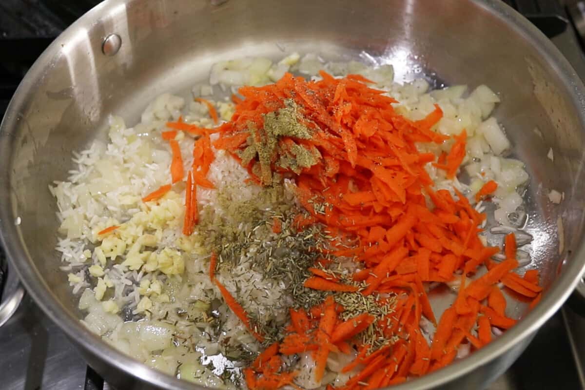 carrots and spices added to the onions