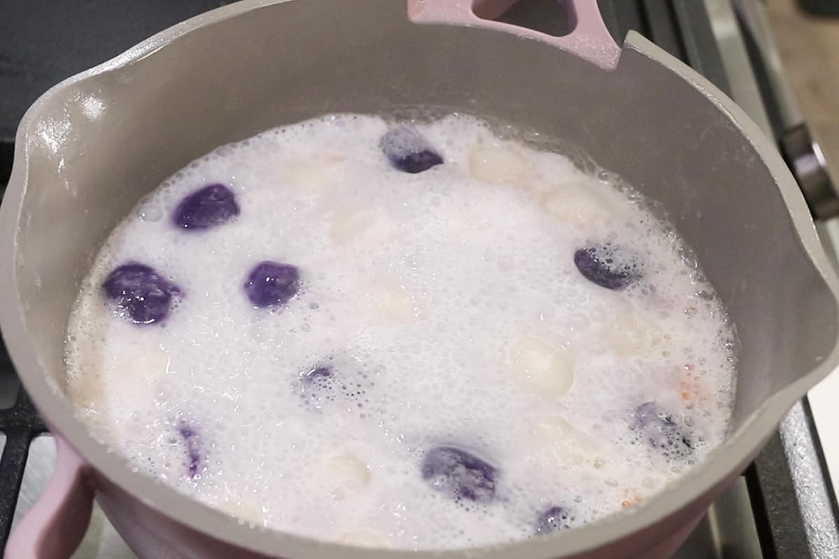 making ginataang bilo bilo in a purple our place pot