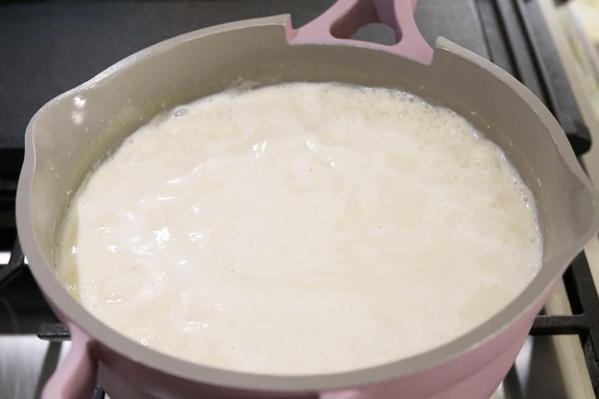 step by step - pot of rice and milk coming to a boil