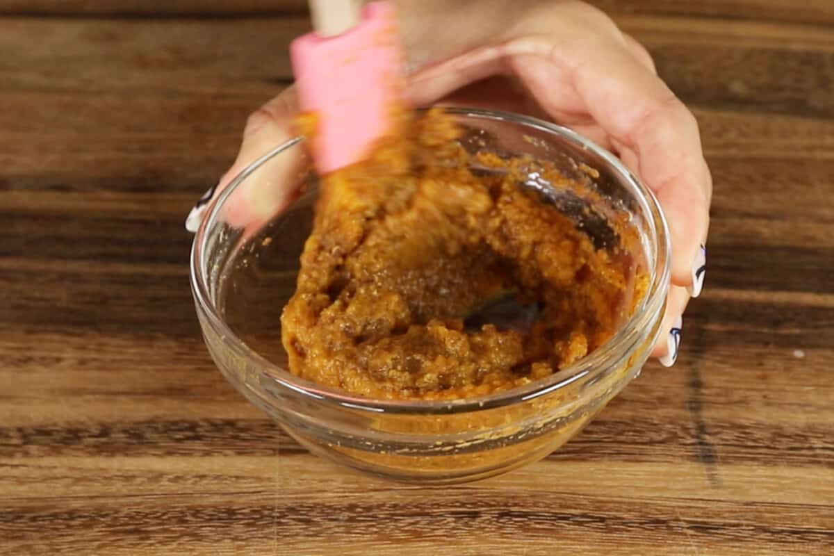 pumpkin puree and spices being mixed