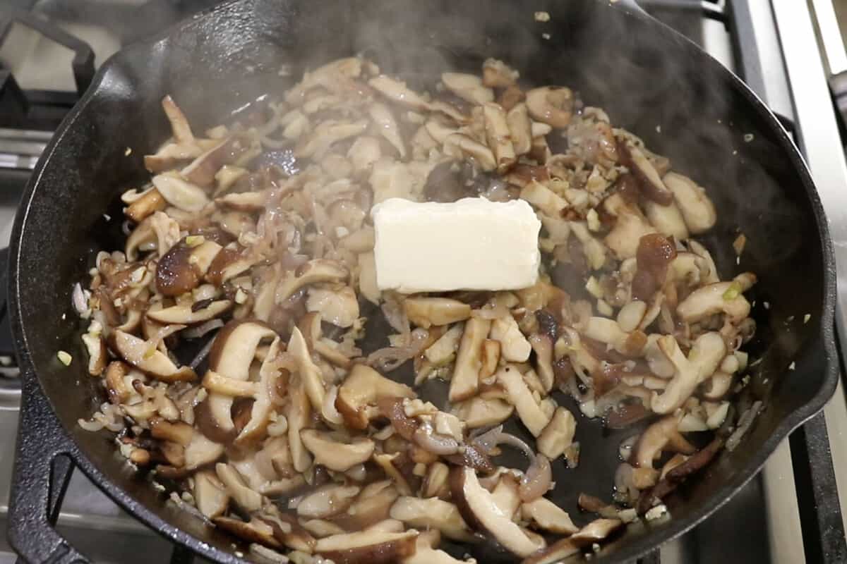 sautéed mushrooms and vegan butter in cast iron skillet