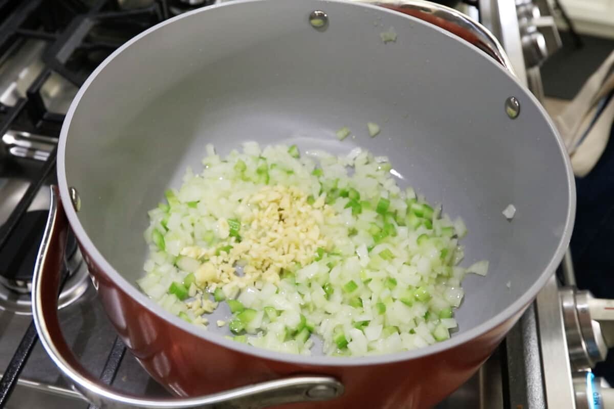 large pot with aromatics for broccoli potato soup