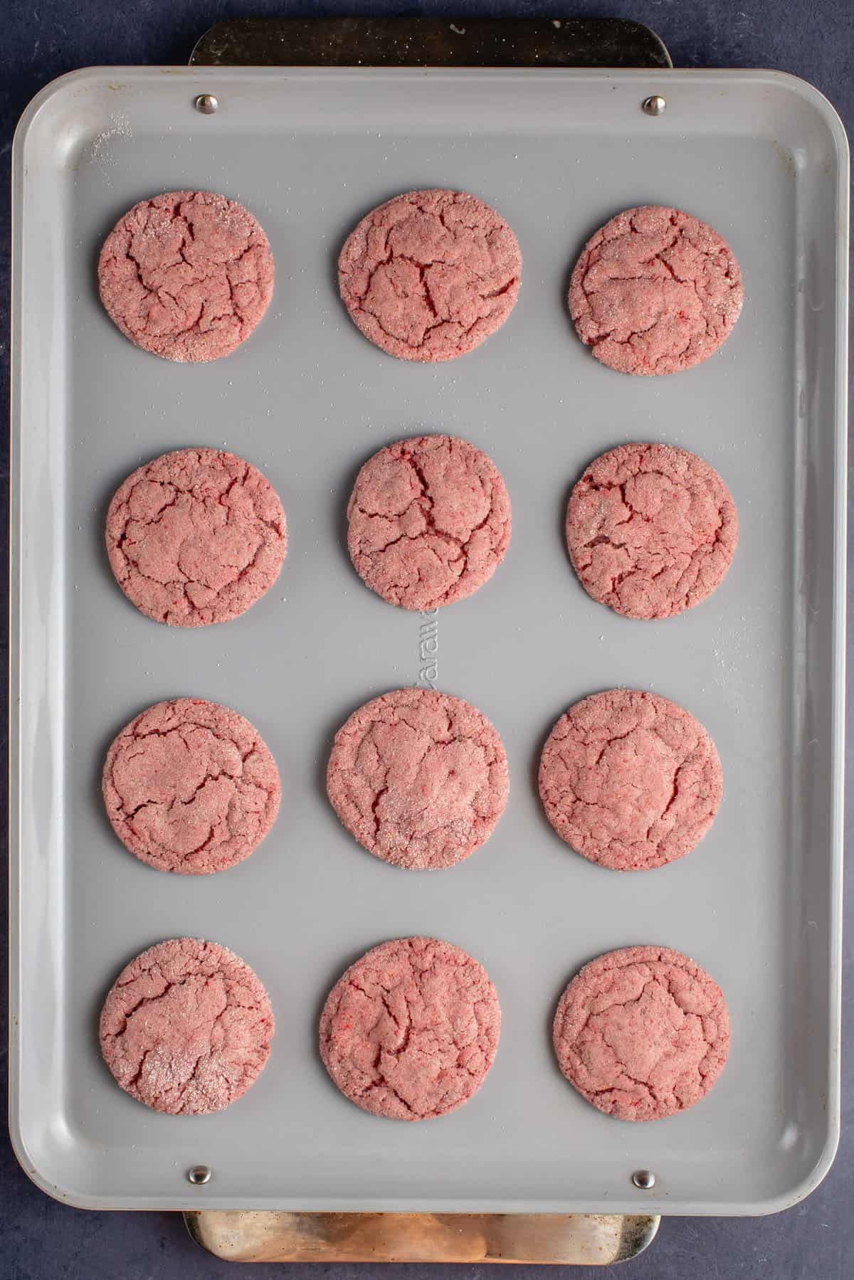 strawberry sugar cookies on nonstick caraway baking sheet