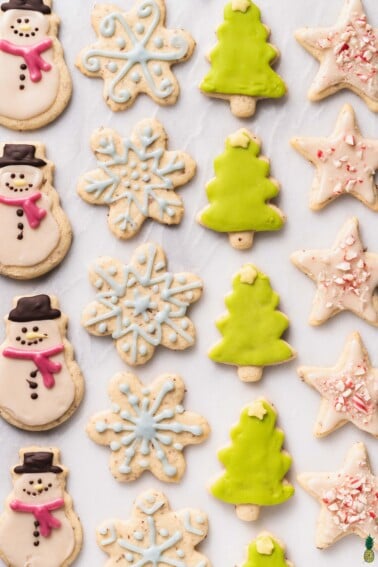 An overhead shot of colorful christmas cookies on a marble board; food photography