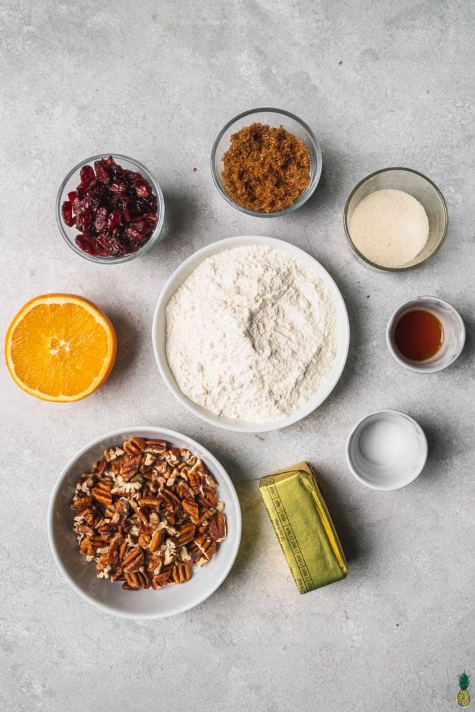 Ingredients to make vegan pecan cranberry orange shortbread cookies
