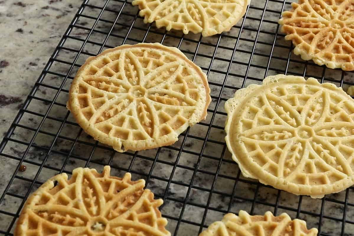 finished pizzelles on cooling rack