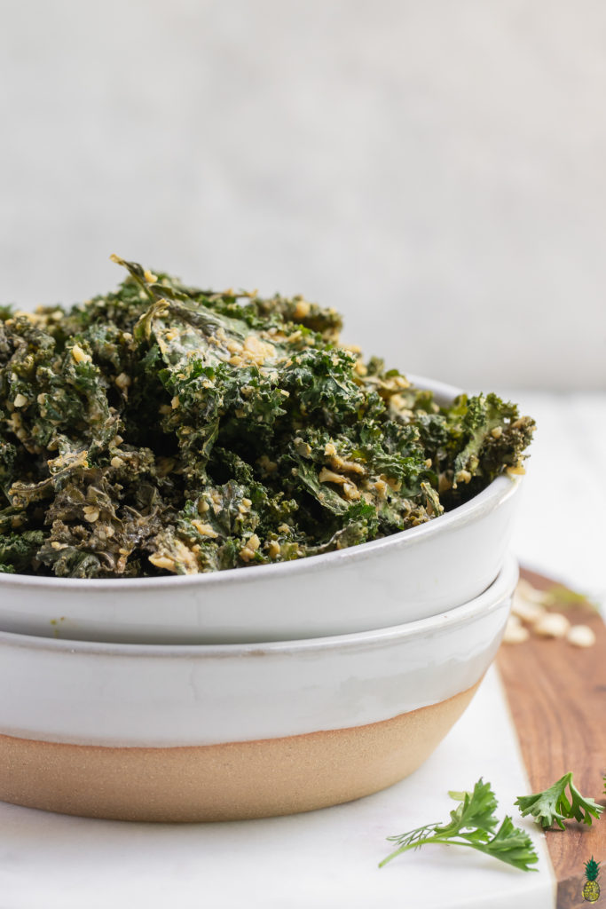 Baked Vegan Ranch Kale Chips up close in a bowl by sweet simple vegan