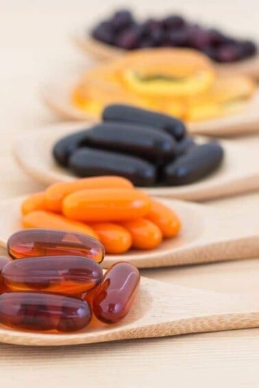 vegan supplements in wooden spoons