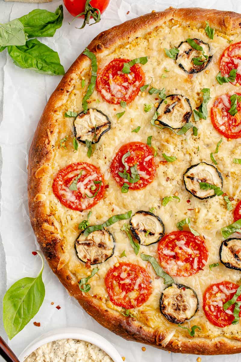 macro image of unsliced white pizza on styled background